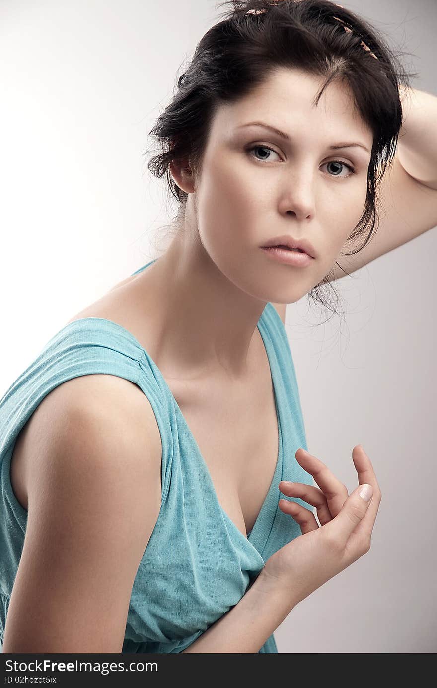 Model in blue dress in studio. Model in blue dress in studio