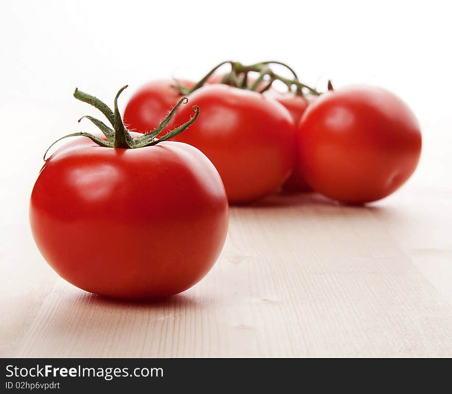 Natural red tomatoes in studio. Natural red tomatoes in studio