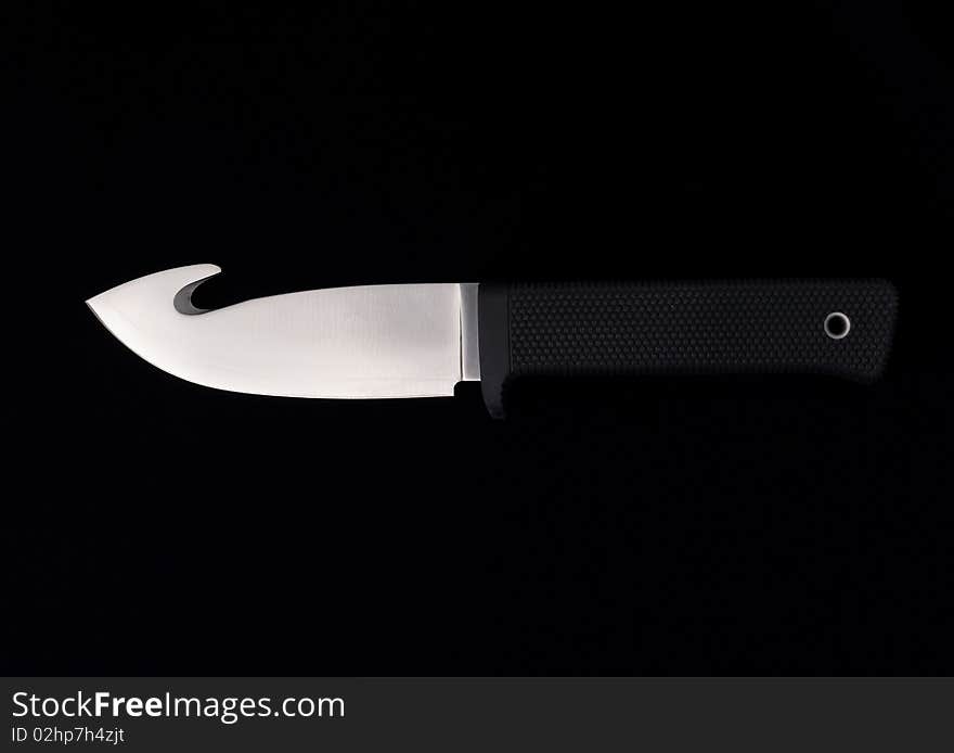 Textured sharpen knife on black background