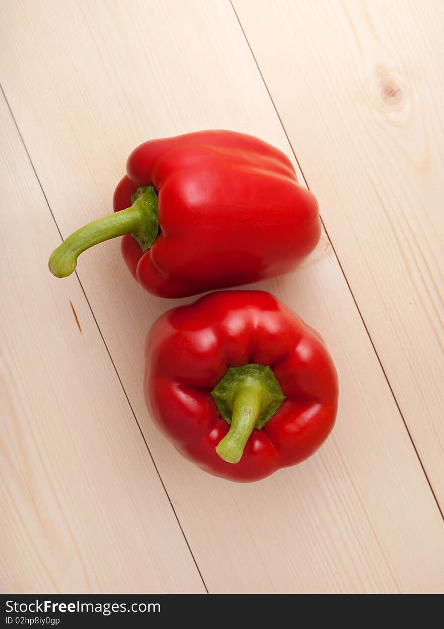 Red pepper on wood floor