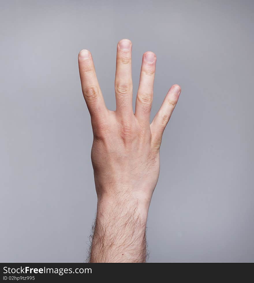 Figure of four fingers on grey background. Figure of four fingers on grey background