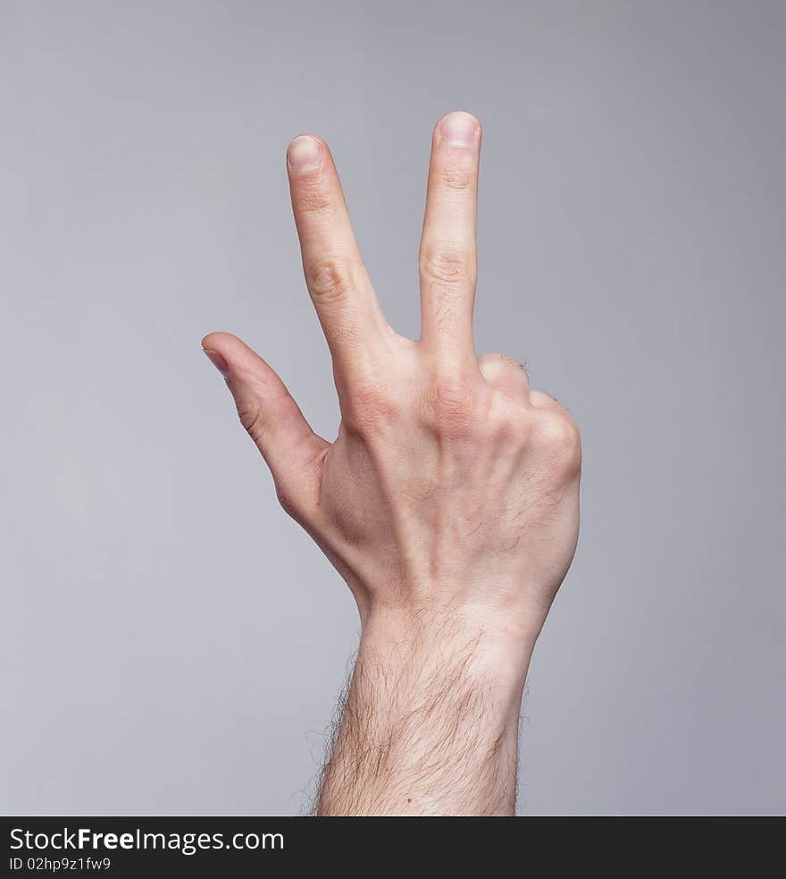 Figure of three fingers on grey background. Figure of three fingers on grey background