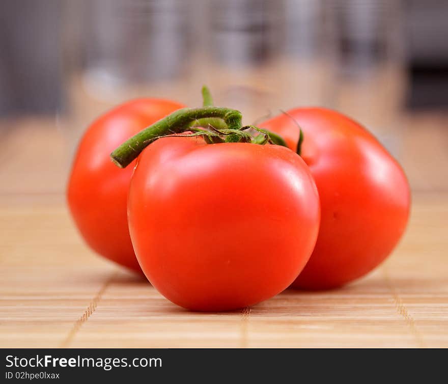 Red salad and tomato on brown bamboo napkin. Red salad and tomato on brown bamboo napkin