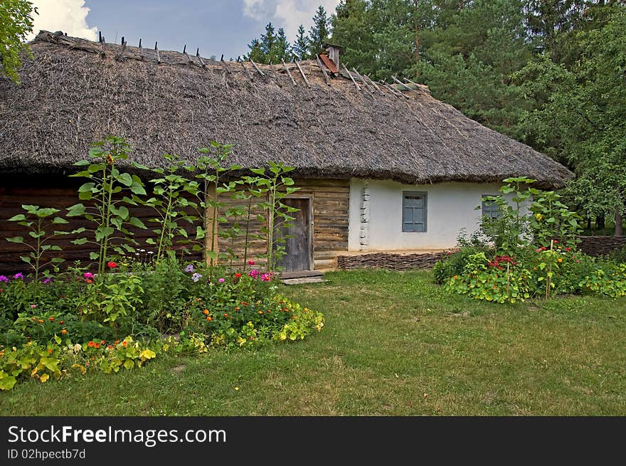 Historic architecture. Old wooden house with yard.