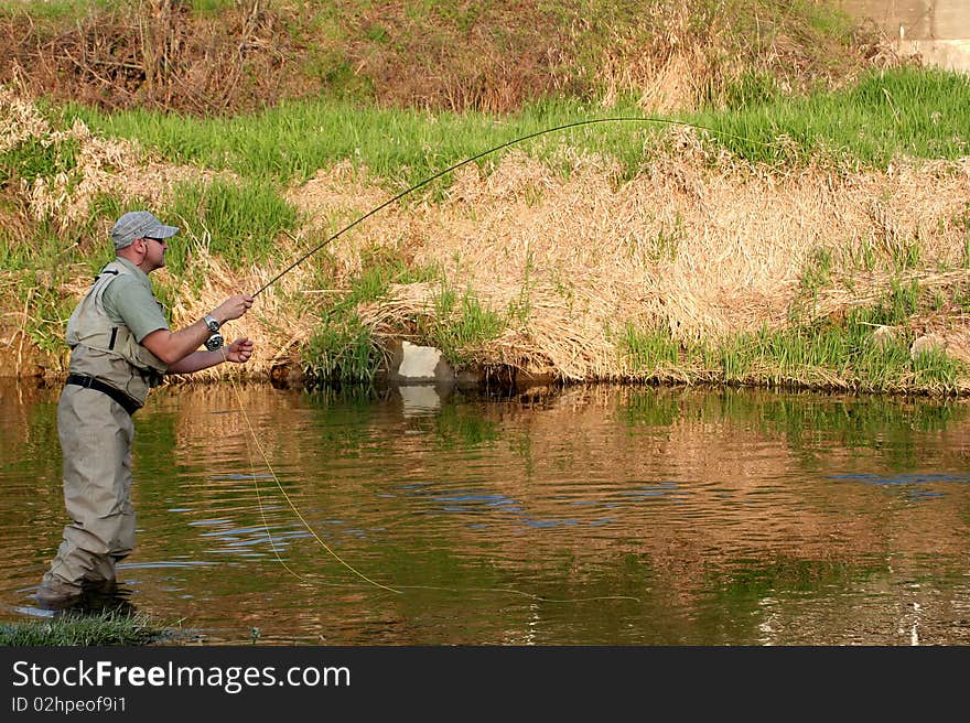 Angler on the small river. Angler on the small river