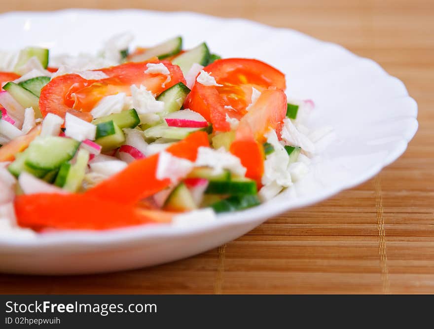 Side dish with green cucumber and red tomato