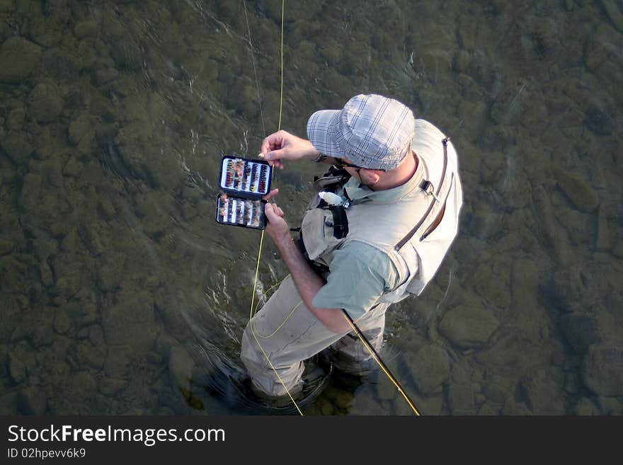 Angler on the small river. Angler on the small river