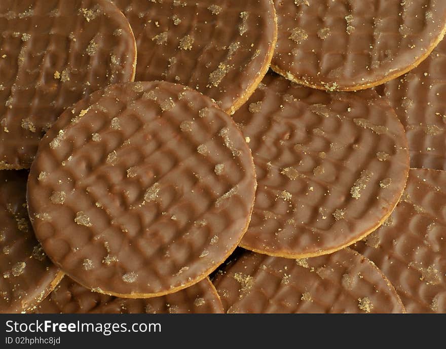 A close up of a pile of chocolate biscuits. A close up of a pile of chocolate biscuits