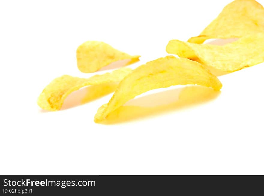 Isolated pile of unhealth snack - potato chips