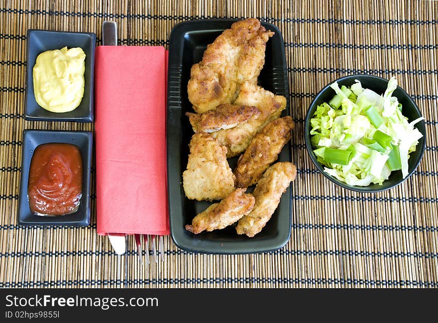 Chicken fingers and light salad for lunch. Chicken fingers and light salad for lunch