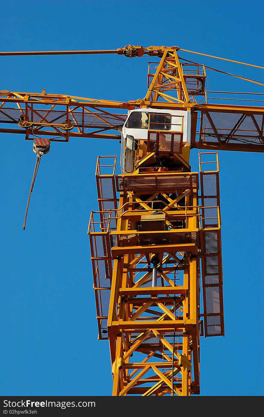 Detail of crane with blue sky in background. Detail of crane with blue sky in background