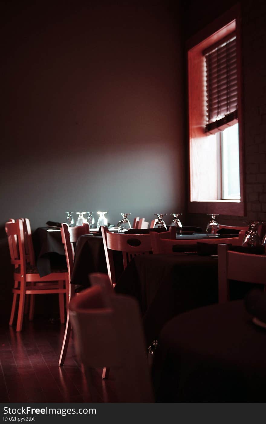 Restaurant dining room tables, natural window light. Restaurant dining room tables, natural window light.