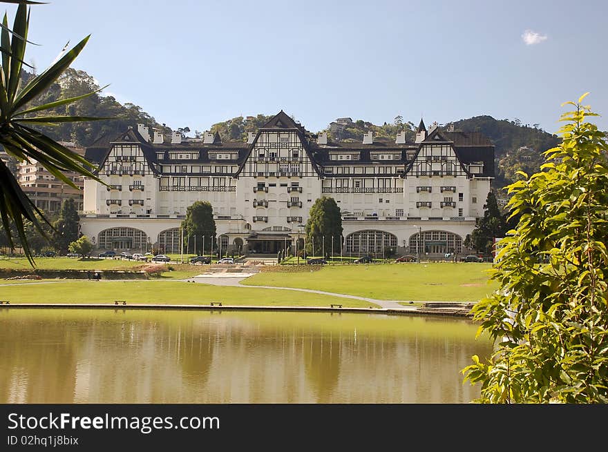 The Quitandinha palace in Petropolis, one of the most representative example of the French Norman style architecture in Brazil. This style of architecture is based on the architecture of houses in Normandy and Brittany after about 1920; usually characterized by steep, conical roofs or hipped roofs, stucco walls, round stair-towers, and an asymmetrical plan. The Quitandinha palace in Petropolis, one of the most representative example of the French Norman style architecture in Brazil. This style of architecture is based on the architecture of houses in Normandy and Brittany after about 1920; usually characterized by steep, conical roofs or hipped roofs, stucco walls, round stair-towers, and an asymmetrical plan.