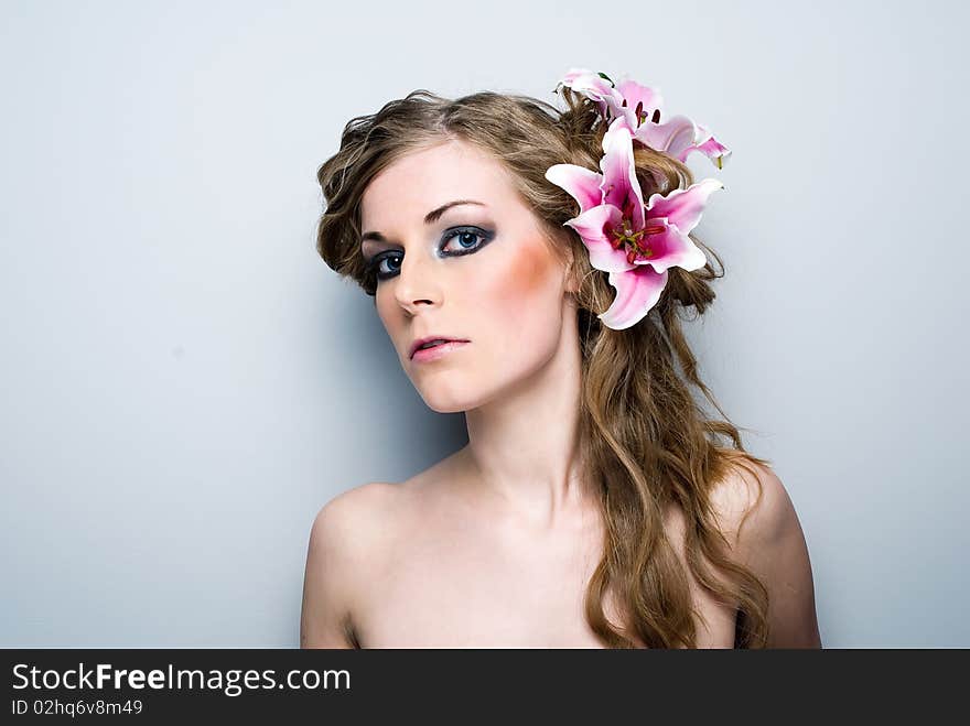 Close-up of beautiful girl with flowers On white background