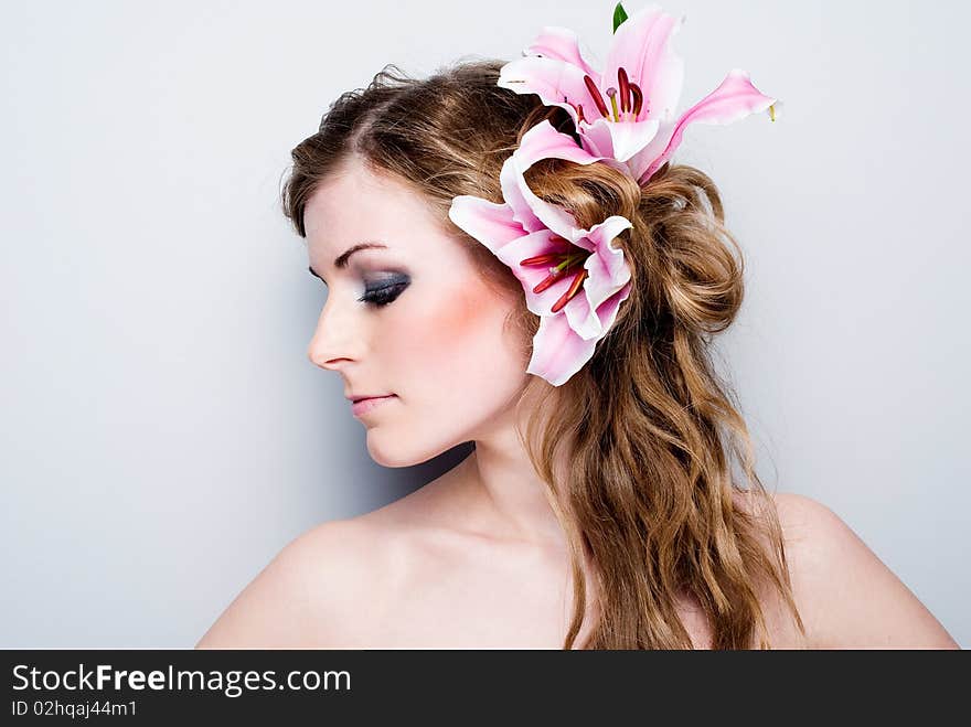 Close-up of beautiful girl with flowers On white background