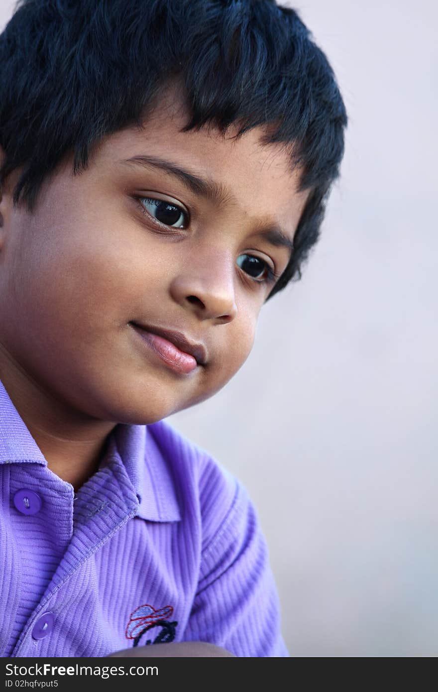 Thoughtful indian little boy looking somewhere