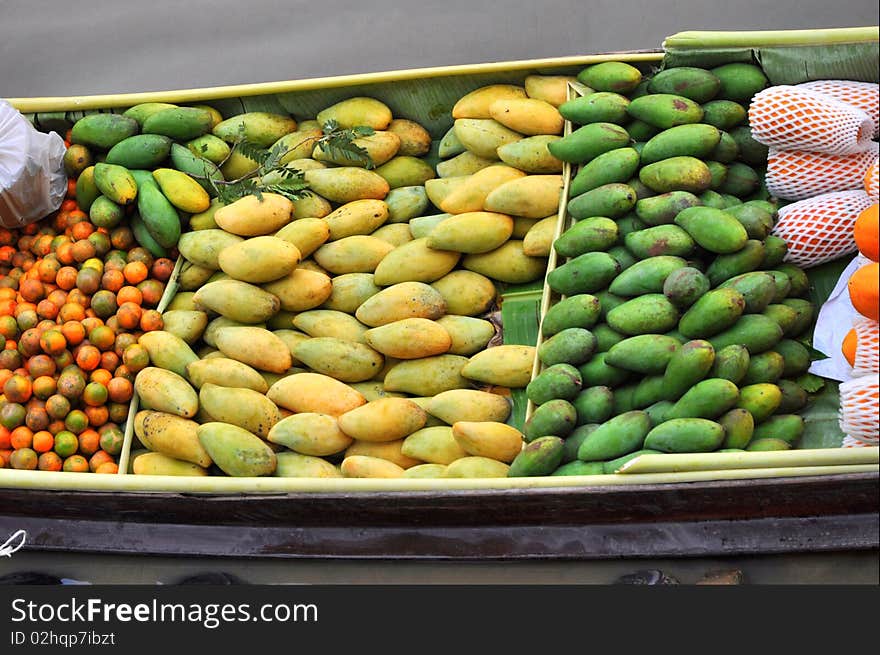 Floating Boat selling fruit in local market. Floating Boat selling fruit in local market.