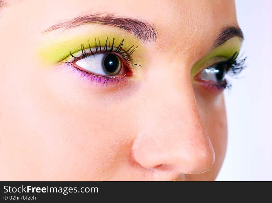 Multicolored make-up. Portrait of young beautiful woman.