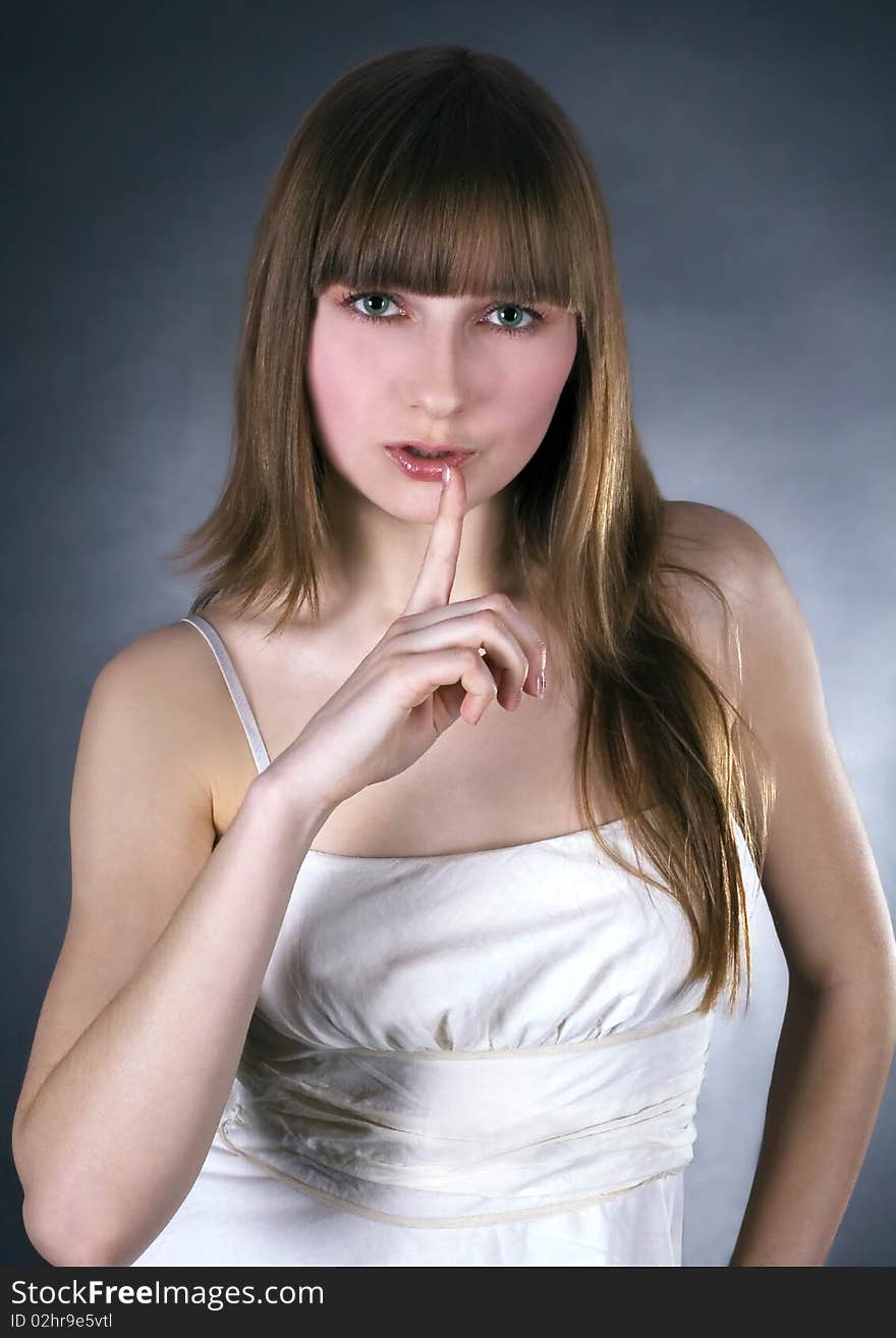 Picture of lovely woman with finger on lips