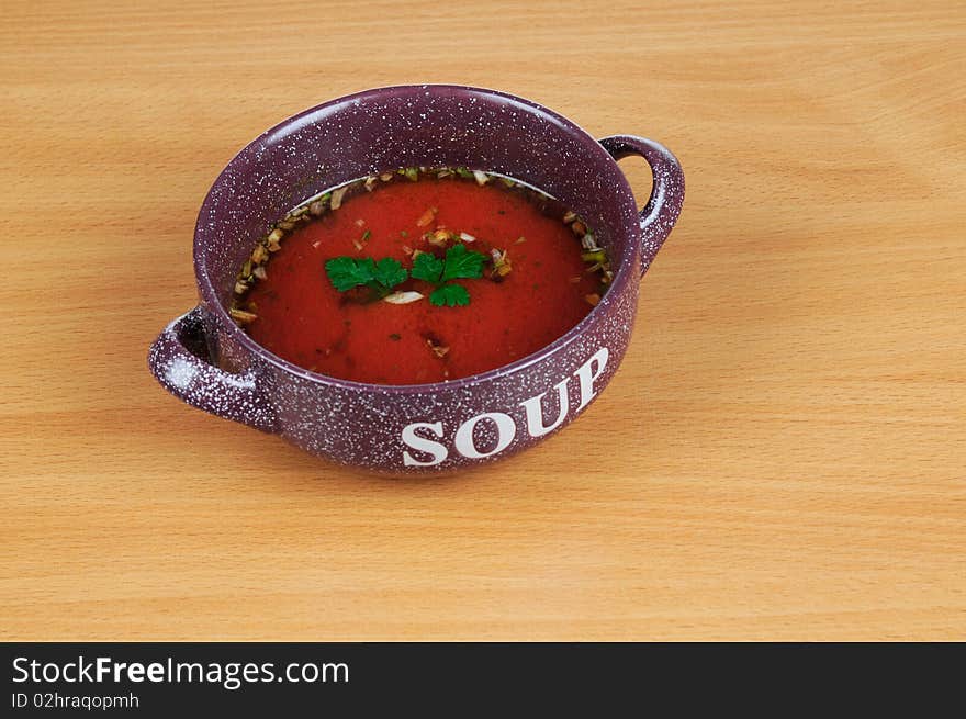 Bowl of tomatoes soup isolated on white background.