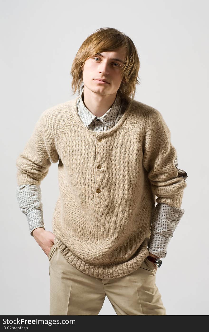 Waist up portrait of young man on light grey background