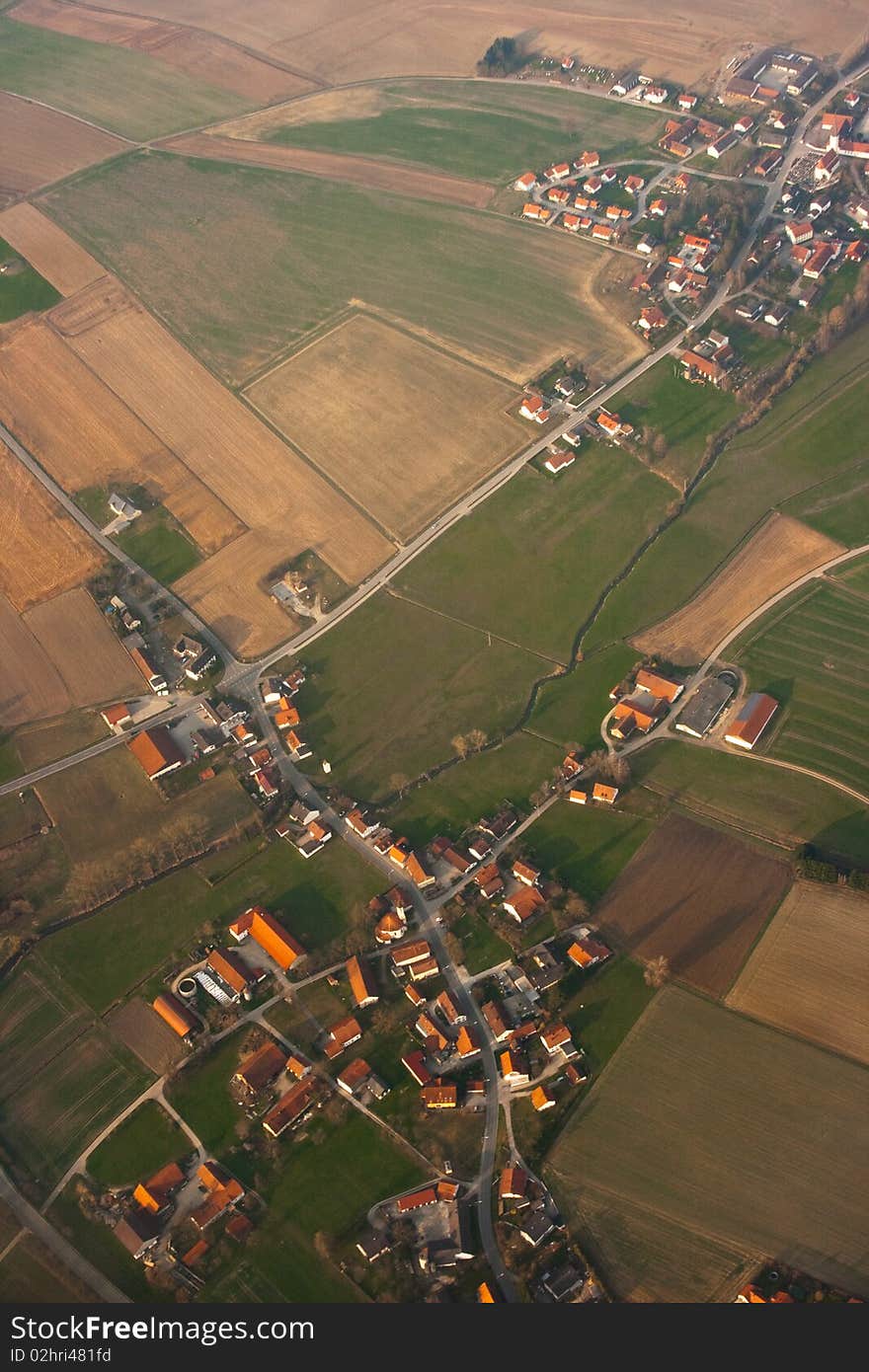 Houses and farms, fields and roads as seen from above. Houses and farms, fields and roads as seen from above