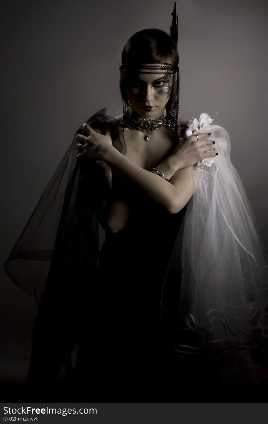 Woman with dark veil and bridal in hands. Woman with dark veil and bridal in hands