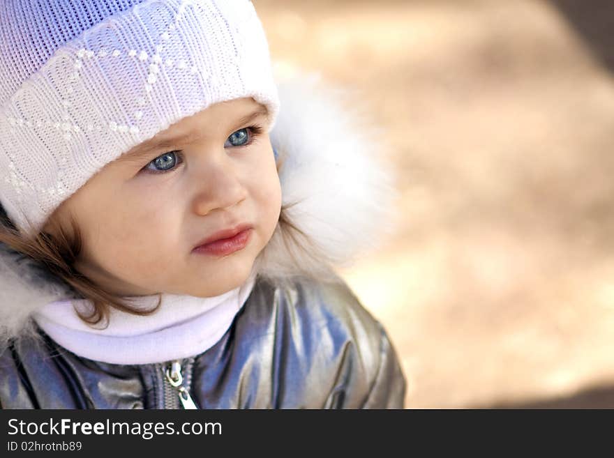 Portrait of a pretty girl with blue eyes