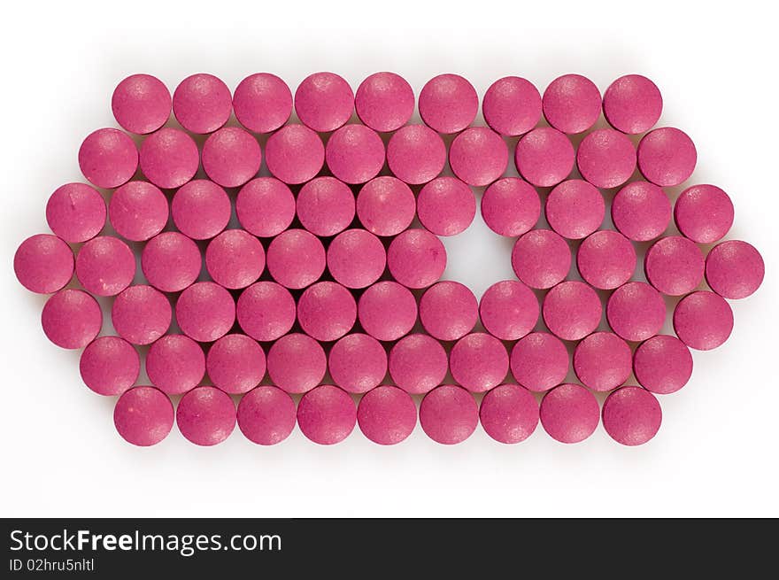 Magenta pills on a white background