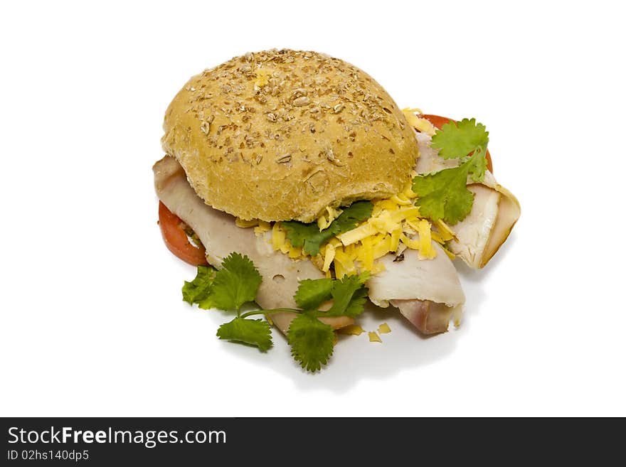 Bun sandwich with ham, cheese and tomato isolated on a white background