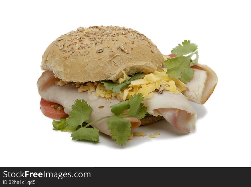 Bun sandwich with ham, cheese and tomato isolated on a white background