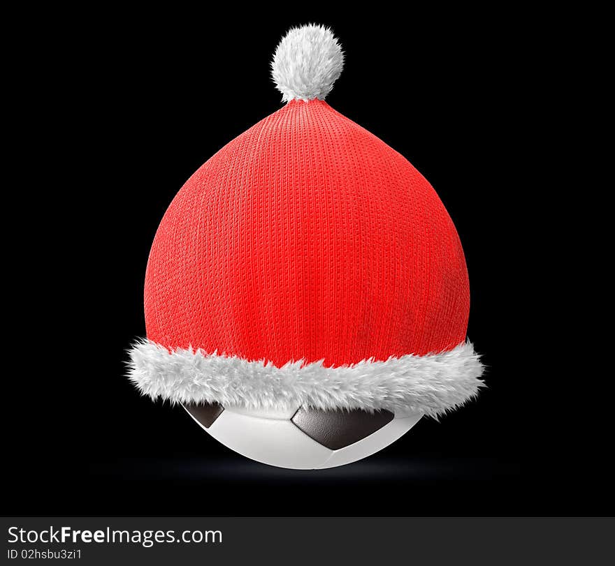 Santa hat on a soccer ball isolated on black background