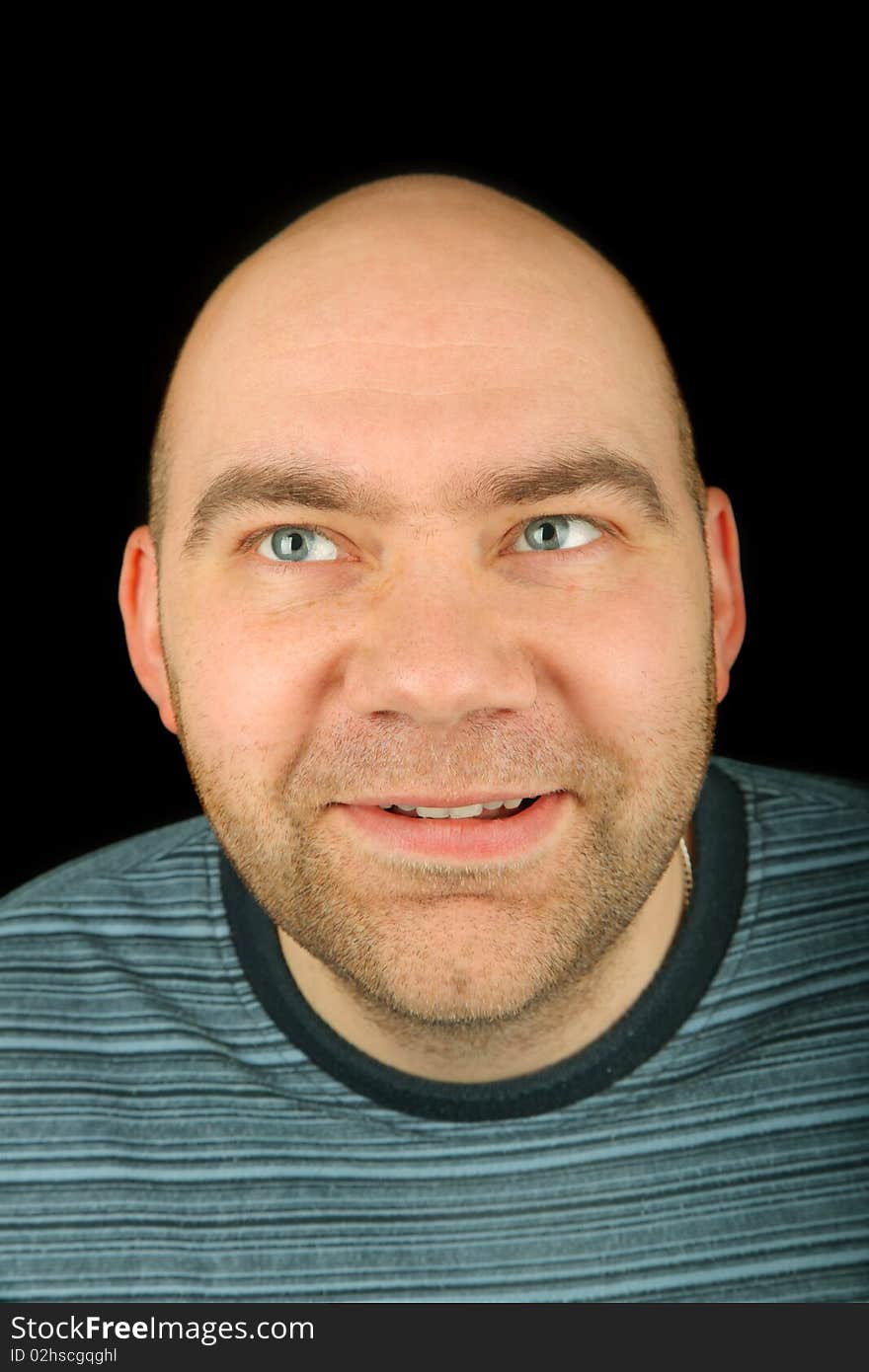 Happy man portrait on a black background