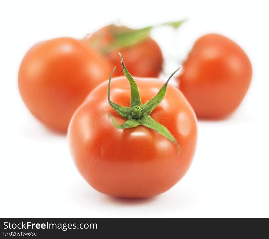 Red tomato on white background