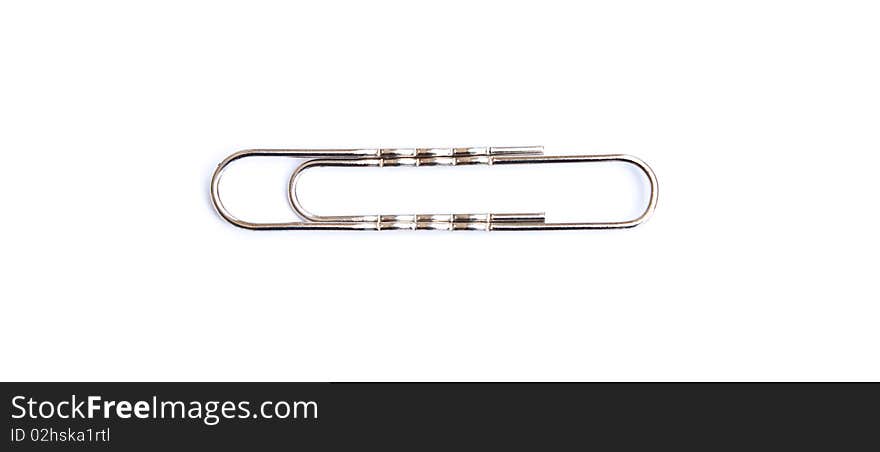 Single metal clip isolated on white background. Single metal clip isolated on white background.