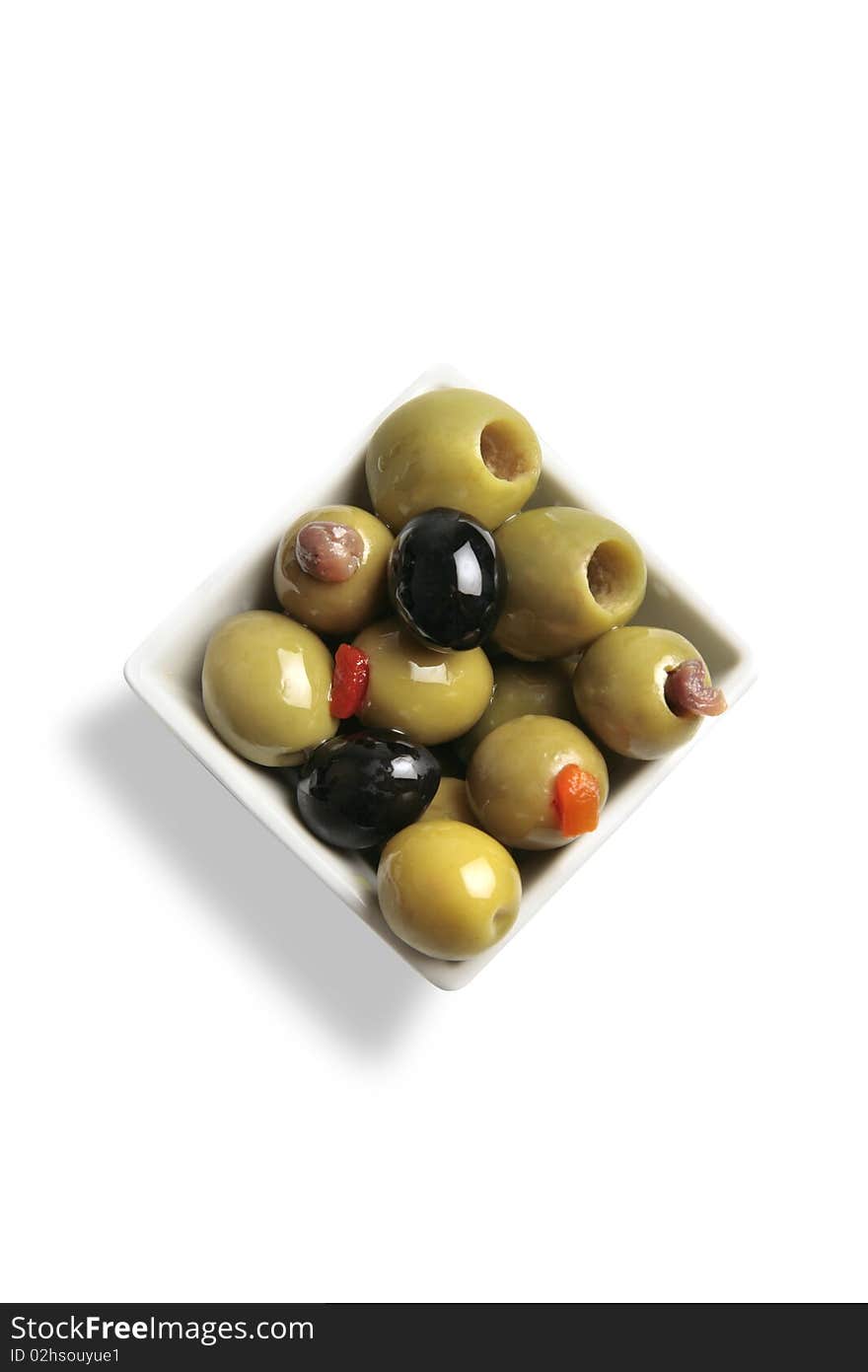 A bowl with a variety of olives. A bowl with a variety of olives