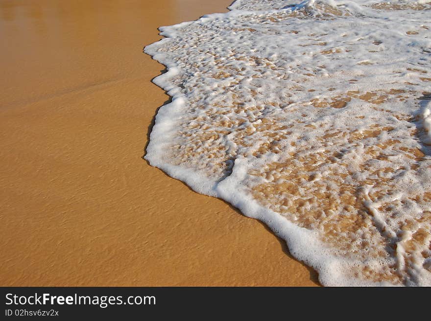 Wave on sand, tropical beach