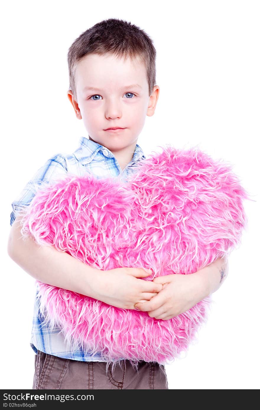 Cute baby boy holding a heart-fur and pink