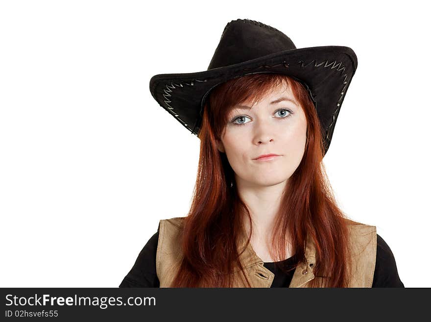 Seriously looking red-haired girl in cowboy hat. Seriously looking red-haired girl in cowboy hat