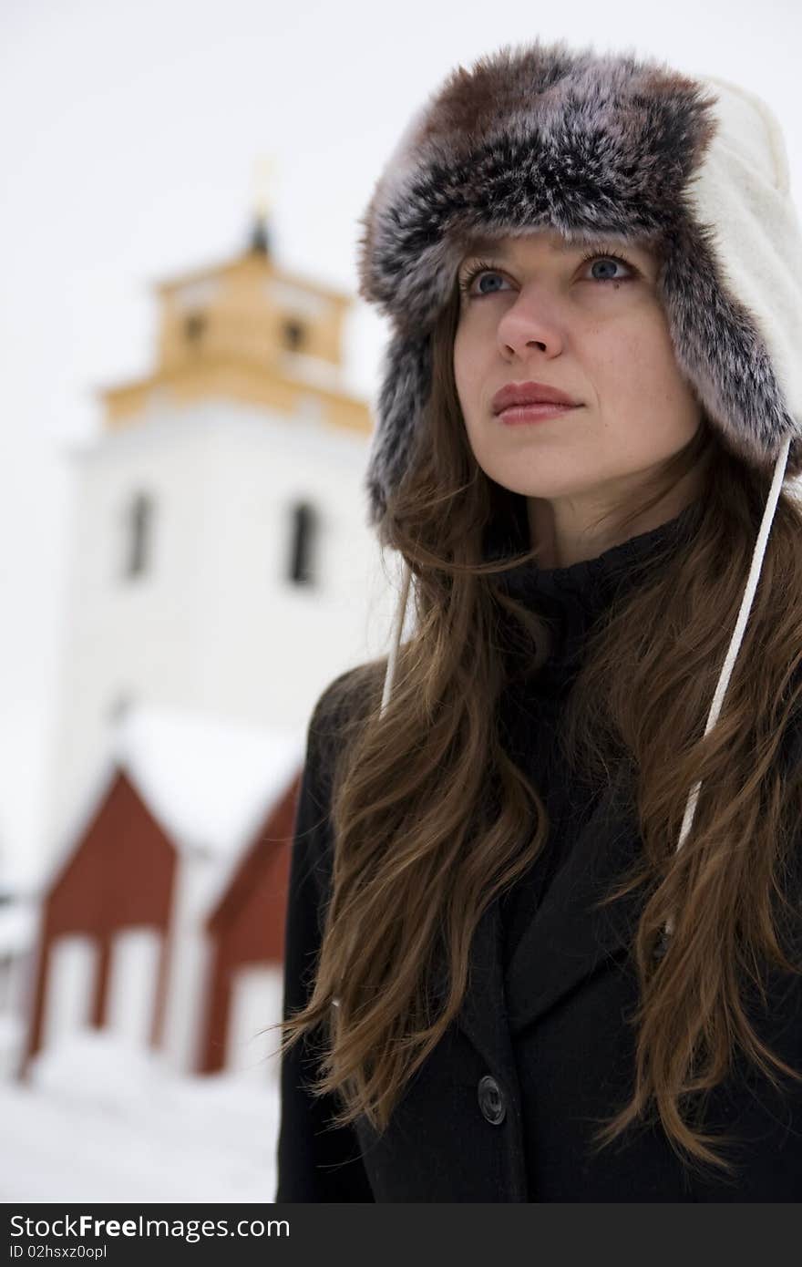 Young beautiful woman in snowy rural environment. Young beautiful woman in snowy rural environment