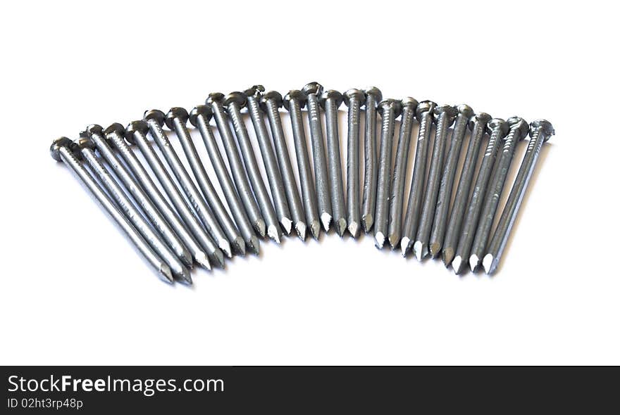 Pile of steel nails isolated on the white background. Pile of steel nails isolated on the white background