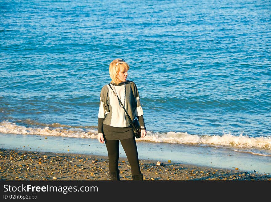 Young woman looking left on the beach