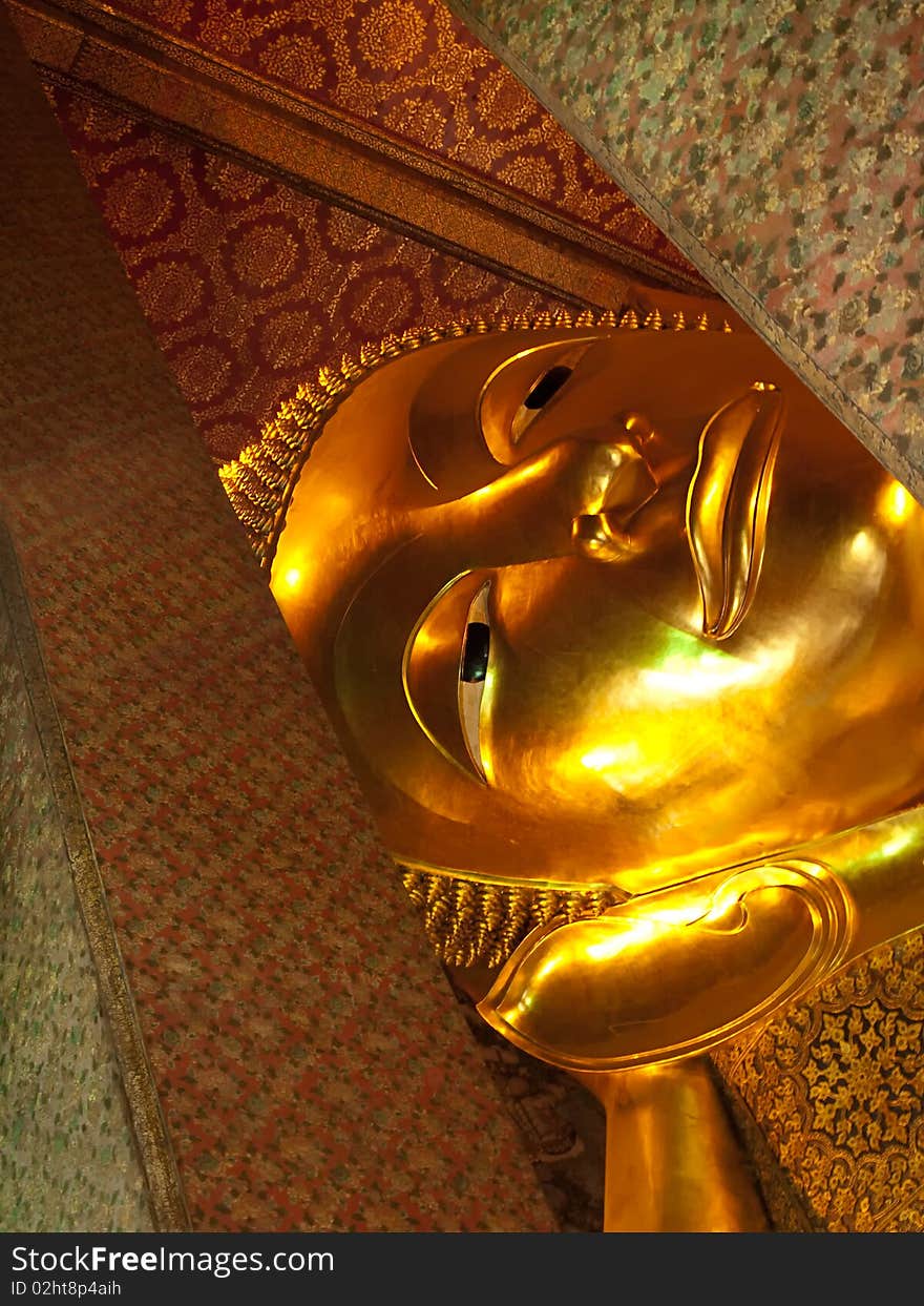 Face of the Reclining Buddha , temple Wat Pho, Bangkok, Thailand