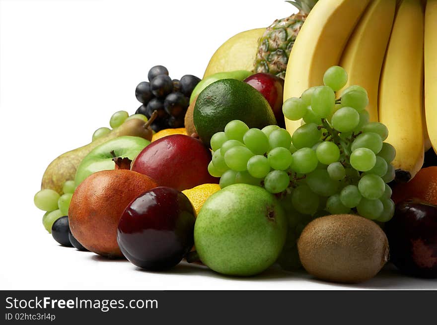 Ripe fresh fruit on white background