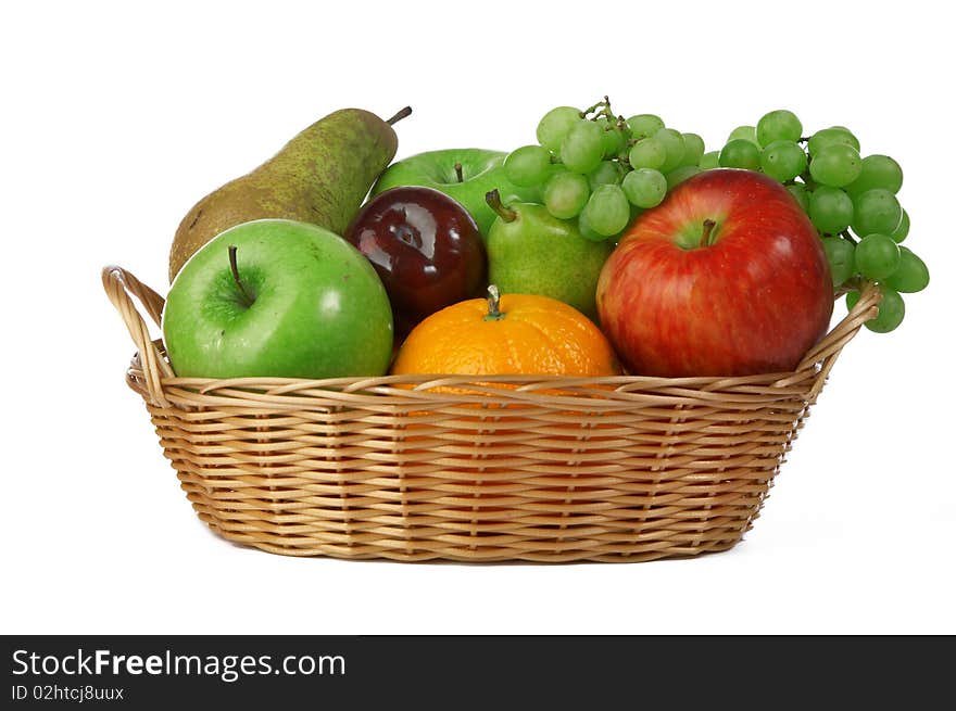 Ripe fresh fruit in basket on white background