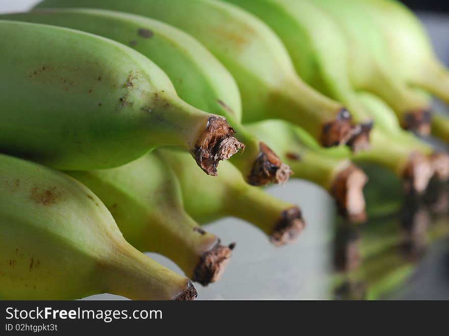 Green Banana closeup with reflection