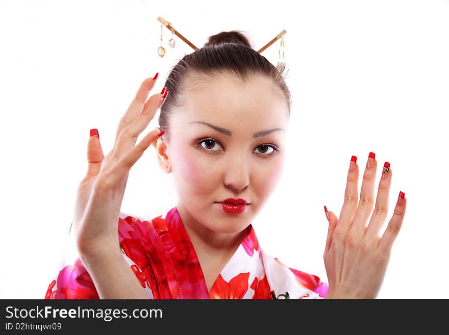 Portrait of the girl of the Asian appearance, with a make-up under the geisha, on a white background. Portrait of the girl of the Asian appearance, with a make-up under the geisha, on a white background