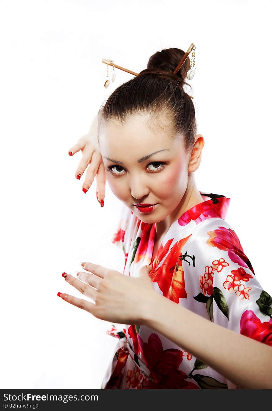 Portrait of the girl of the Asian appearance, with a make-up under the geisha, on a white background. Portrait of the girl of the Asian appearance, with a make-up under the geisha, on a white background