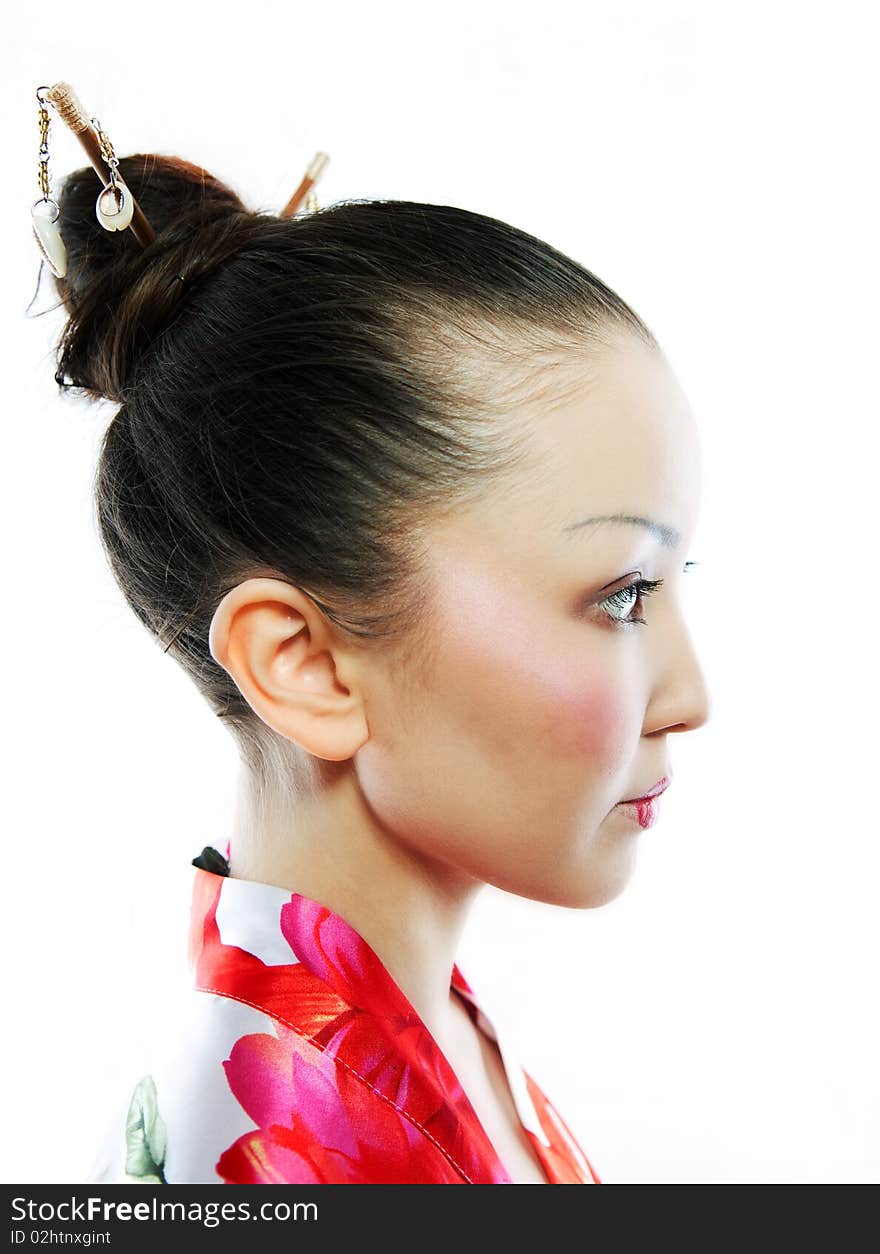 Portrait of the girl of the Asian appearance, with a make-up under the geisha, on a white background. Portrait of the girl of the Asian appearance, with a make-up under the geisha, on a white background