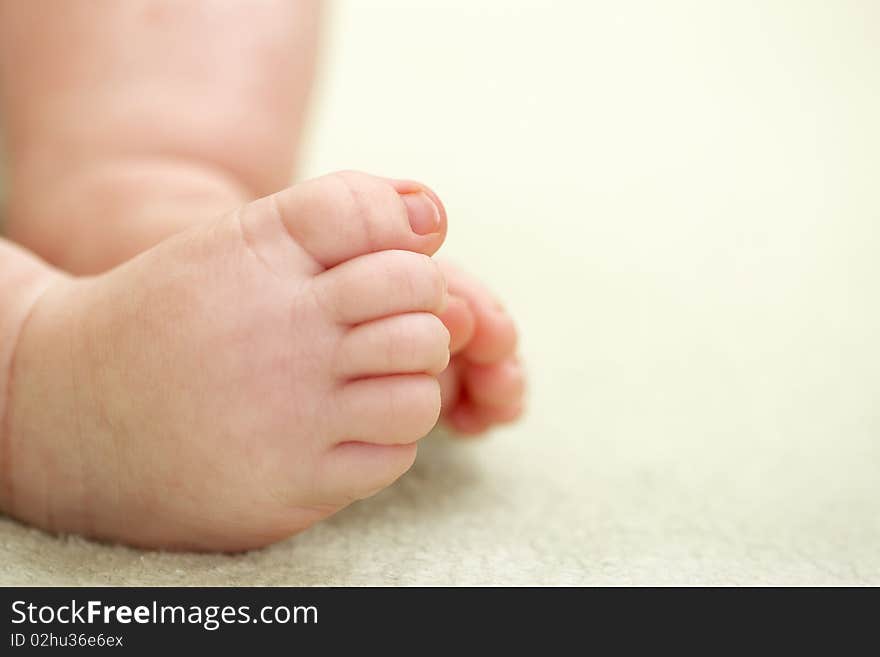 A newborn baby closeup feet. shallow DOF, focus on toes